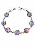 Making Waves Jewelry and Accessories sterling silver link bracelet with multi-colored turquoise cabochon stones.