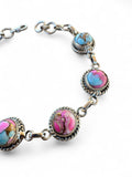 Making Waves Jewelry and Accessories artisan bracelet with multi-colored turquoise stones in twisted sterling silver