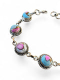 Making Waves Jewelry and Accessories artisan bracelet with multi-colored turquoise stones in twisted sterling silver