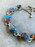 Making Waves Jewelry and Accessories oval copper turquoise and sterling silver link bracelet with toggle clasp