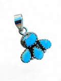 Making Waves Jewelry and Accessories turquoise cluster pendant with sterling silver rope detailing on white background