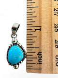 Making Waves Jewelry and Accessories turquoise pendant in 925 sterling silver with rope and bead detail next to ruler