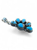 Making Waves Jewelry and Accessories sterling silver pendant featuring five turquoise stones with rope-edge detailing.