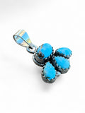 Making Waves Jewelry and Accessories turquoise cluster pendant with four stones set in polished sterling silver