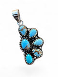 Making Waves Jewelry and Accessories sterling silver pendant featuring five turquoise stones with rope-edge detailing.