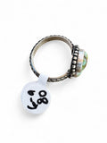 Making Waves Jewelry and Accessories sterling silver bypass ring with green turquoise stones and leaf-pattern band