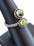 Making Waves Jewelry and Accessories sterling silver bypass ring with two oval green turquoise stones and leaf band.