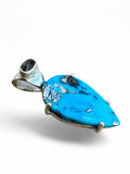 Making Waves Jewelry and Accessories handcrafted teardrop turquoise pendant in 925 sterling silver with dark gemstone bail