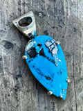 Making Waves Jewelry and Accessories handcrafted teardrop turquoise pendant in 925 sterling silver with dark gemstone bail