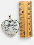 Making Waves Jewelry and Accessories heart pendant with White Buffalo stone and sterling silver beaded wire border.