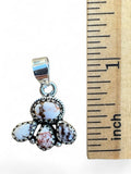 Making Waves Jewelry and Accessories sterling silver pendant with White Buffalo turquoise stones next to a ruler.