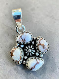Making Waves Jewelry and Accessories sterling silver pendant with four teardrop white buffalo stones and floral detail.