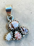 Making Waves Jewelry and Accessories sterling silver pendant with a floral cluster of White Buffalo turquoise stones.